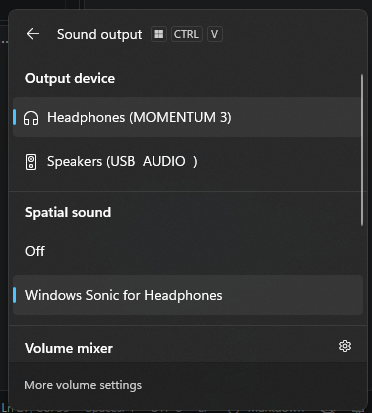 A screenshot of the quick settings menu for Windows, showing a select modal for Output Device but not for Communications Output Device